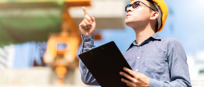 smart-asian-male-professional-civil-engineer-hand-hold-clip-board-site-construction-check-with-infastrcture-building-background (1)